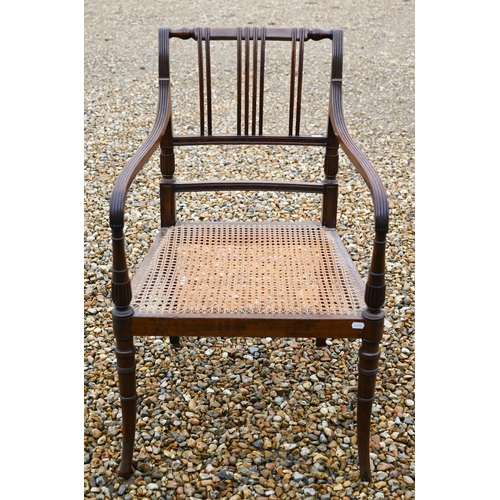 260 - A 19th century mahogany elbow chair with caned seat