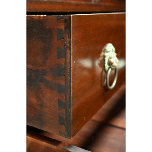 267 - #A two door cupboard with shelved interior and two drawers with lion mask brass handles, 82 x 40 x 1... 