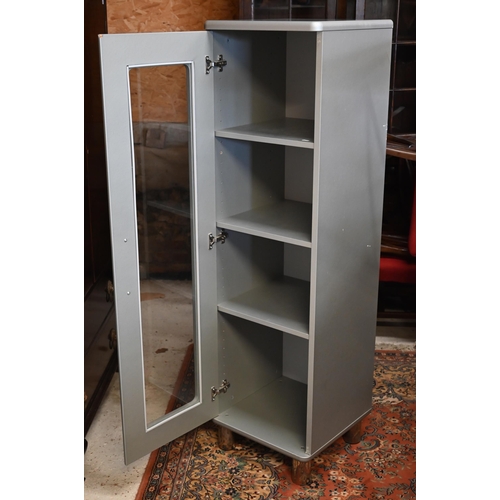 268 - #A modern grey painted 'Malibu' cupboard with glazed door, cylindrical chrome feet and three adjusta... 