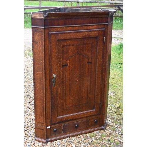 269 - A Georgian oak hanging corner cupboard a/f, 80 x 120 cm