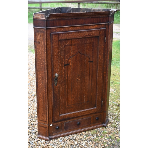 269 - A Georgian oak hanging corner cupboard a/f, 80 x 120 cm