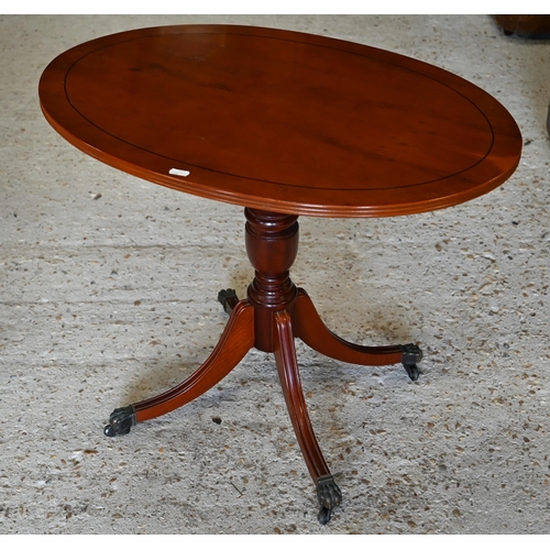 273 - Yew veneered nest of three occasional tables to/w an oval occasional table and a circular tripod lam... 