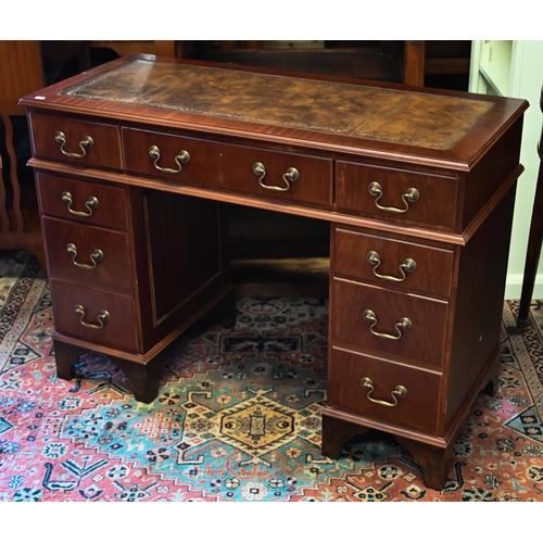 274 - A reproduction mahogany twin pedestal desk with tooled leather top, 104 x 44 x 74 cm h