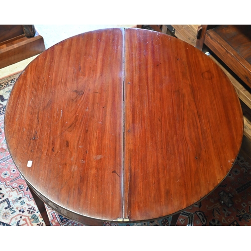 276 - #A 19th century mahogany demi-lune tea table, re-stained folding top, moulded supports and brass cas... 