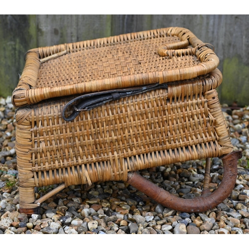 277 - A vintage 1950s rattan wicker fishing chair with folding back supports by two leather straps