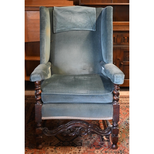 278 - An antique oak framed wingback armchair in blue dralon upholstery, 80 cm w x 55 cm d x 176 cm h o/a