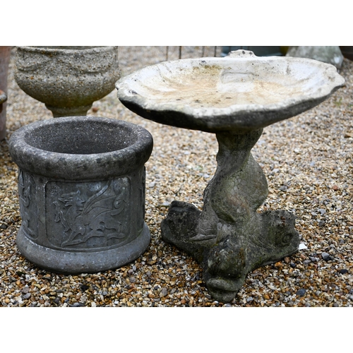 28 - A cast stone scallop shell form bird bath raised on a dolphin base, weathered, 48 cm h to/with a cas... 