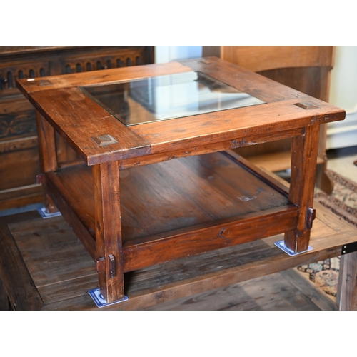 280 - #A rustic stained hardwood square coffee table with inset glass top and open under-tier, 80 x 80 x 5... 