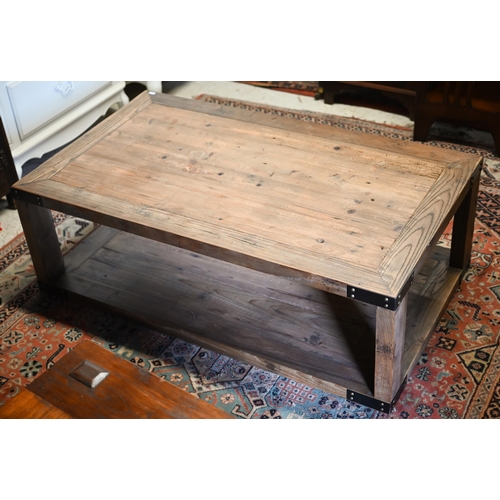 281 - A rustic steel bound reclaimed pine two-tier coffee table, 120 cm x 70 cm x 40 cm h