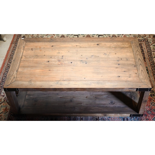 281 - A rustic steel bound reclaimed pine two-tier coffee table, 120 cm x 70 cm x 40 cm h