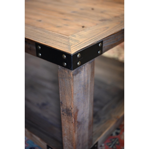 281 - A rustic steel bound reclaimed pine two-tier coffee table, 120 cm x 70 cm x 40 cm h