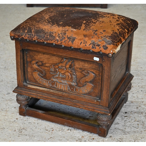 285 - An oak leather top box stool carved with 'Immaculata Gens' Welsh heraldic crest to front (unstained ... 