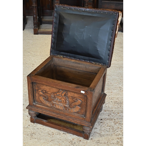 285 - An oak leather top box stool carved with 'Immaculata Gens' Welsh heraldic crest to front (unstained ... 