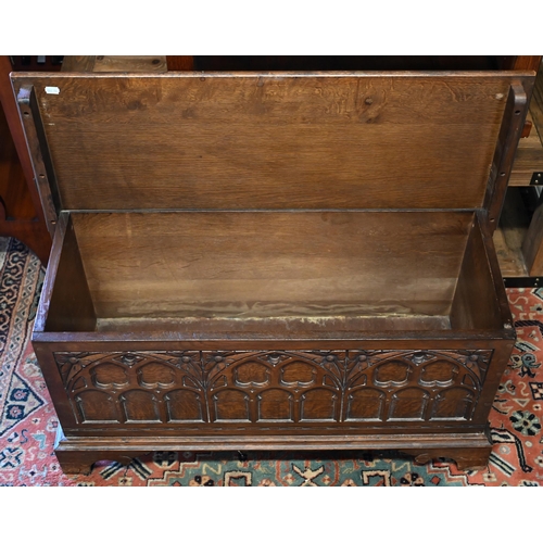 288 - A 17th century style oak coffer with Gothic arch carved front and shaped bracket feet, 94 x 40 x 46 ... 