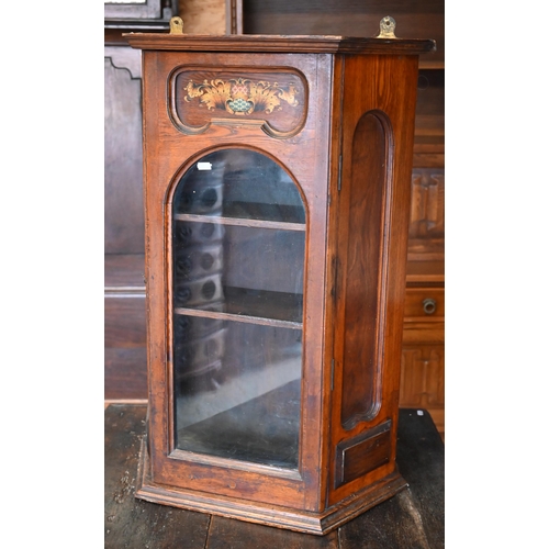 293 - An early 20th century oak wall hanging cabinet painted with heraldic crest over glazed door, 53  x 2... 