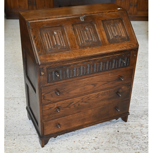 295 - A 'Jaycee Furniture' stamped oak bureau with carved linenfold panels in Tudor manner, 78 x 40 x 78 c... 