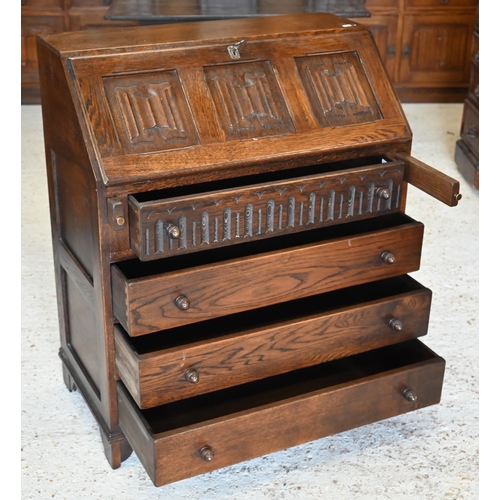 295 - A 'Jaycee Furniture' stamped oak bureau with carved linenfold panels in Tudor manner, 78 x 40 x 78 c... 