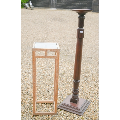 297 - A mahogany jardiniere stand with turned and carved column on square platform base, 150 cm h to/w a m... 