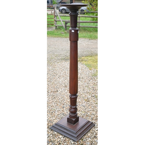 297 - A mahogany jardiniere stand with turned and carved column on square platform base, 150 cm h to/w a m... 