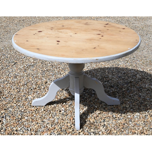 299 - A part-painted pine circular dining table, turned column and quadraform supports, 120 cm dia. x 75 c... 