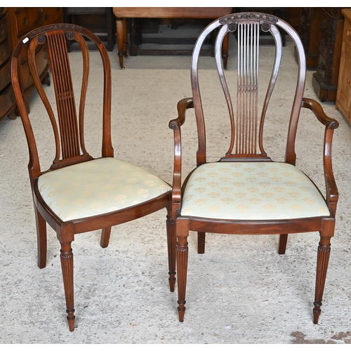 300 - Three mahogany lyre-back dining chairs (1 carver, 2 standard) to/w a carved walnut side chair (4)