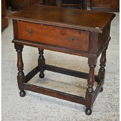 302 - #An antique oak side table with single frieze drawer on turned supports united by stretchers, 78 x 4... 