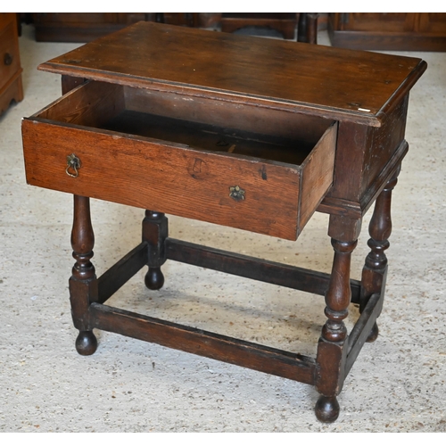 302 - #An antique oak side table with single frieze drawer on turned supports united by stretchers, 78 x 4... 