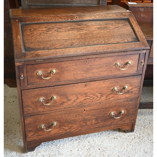 304 - An oak fall front bureau with three long graduating drawers, 90 x 54 x 96 cm