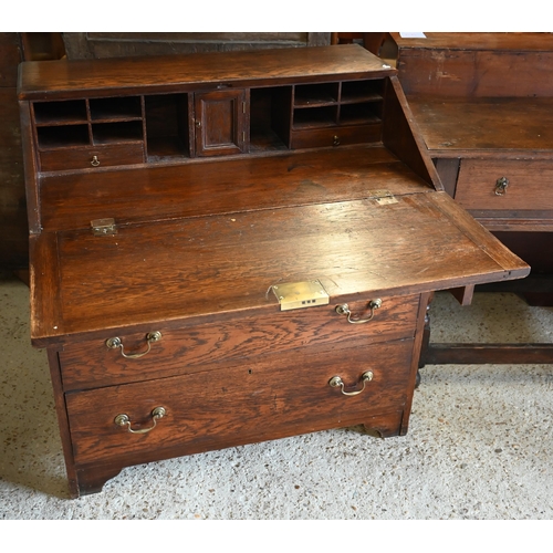 304 - An oak fall front bureau with three long graduating drawers, 90 x 54 x 96 cm