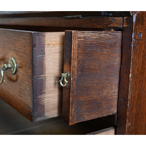 304 - An oak fall front bureau with three long graduating drawers, 90 x 54 x 96 cm