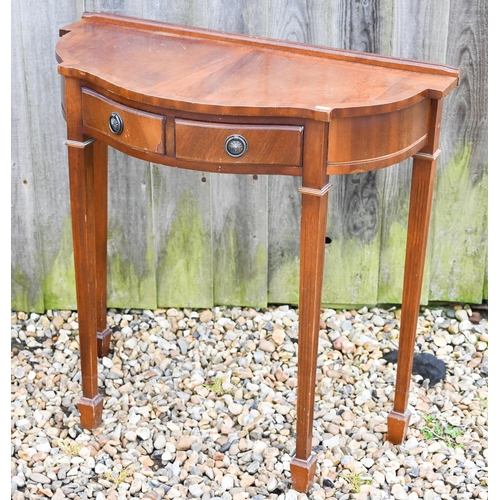 311 - A reproduction mahogany veneer hall table with two drawers, 78 x 36 x 74 cm h to/w an octagonal 'dru... 