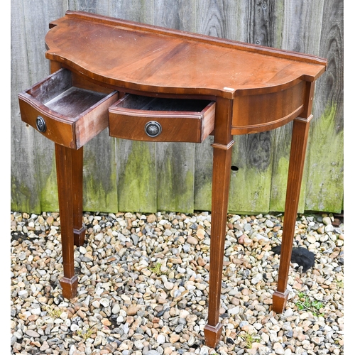 311 - A reproduction mahogany veneer hall table with two drawers, 78 x 36 x 74 cm h to/w an octagonal 'dru... 