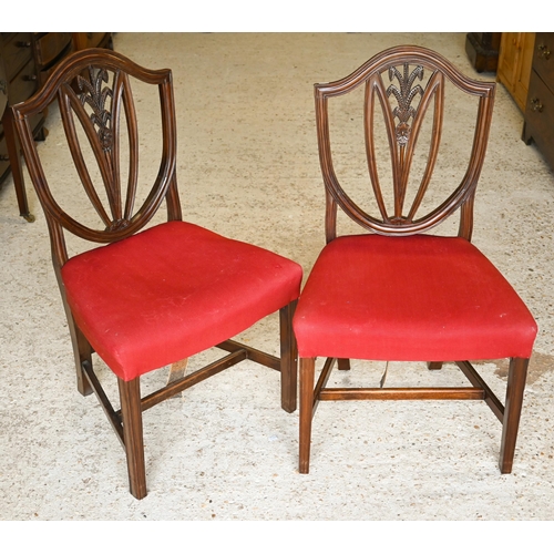 314 - #A set of six Edwardian mahogany Hepplewhite style shield-back dining chairs carved with wheat-sheaf... 