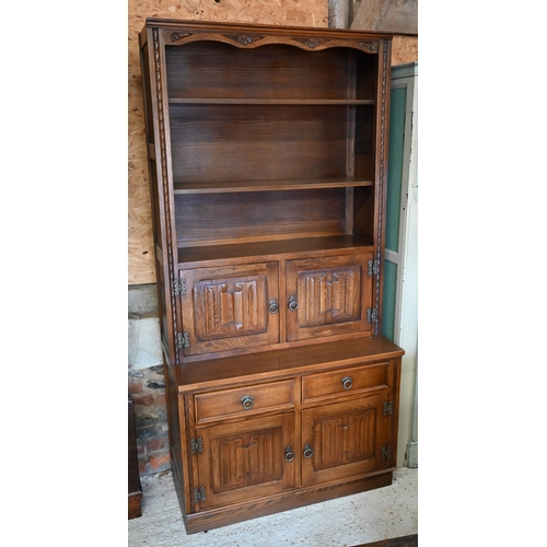 315 - Jaycee Furniture Ltd (Brighton) a companion pair of linenfold panelled oak wall units, one with latt... 