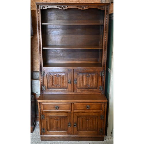 315 - Jaycee Furniture Ltd (Brighton) a companion pair of linenfold panelled oak wall units, one with latt... 