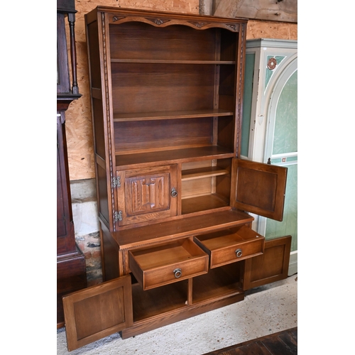 315 - Jaycee Furniture Ltd (Brighton) a companion pair of linenfold panelled oak wall units, one with latt... 