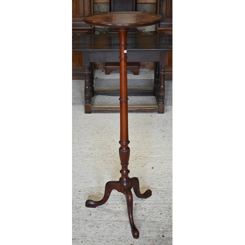 317 - A mahogany jardiniere stand on turned column and triform supports, 40 cm dia. x 122 cm h