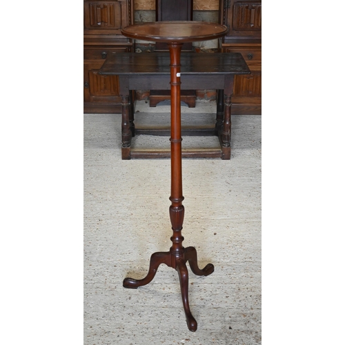 317 - A mahogany jardiniere stand on turned column and triform supports, 40 cm dia. x 122 cm h