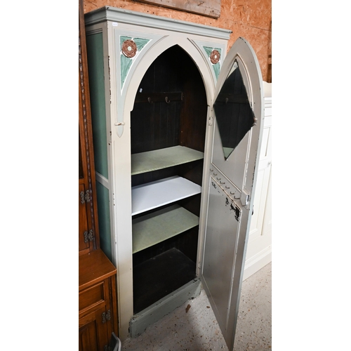 319 - #A painted and Tudor Rose carved wardrobe with Gothic arch panelled door, shelved interior, 80 x 40 ... 