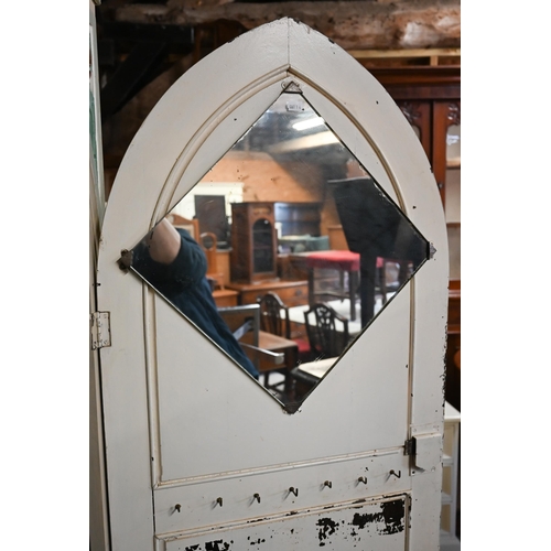 319 - #A painted and Tudor Rose carved wardrobe with Gothic arch panelled door, shelved interior, 80 x 40 ... 