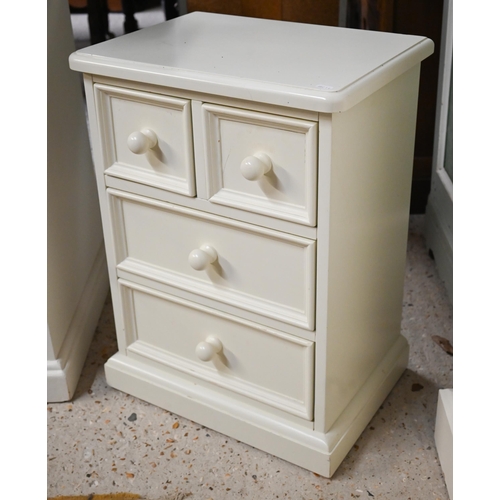 321 - An off-white painted child's bedroom chest, arrangement of thirteen drawers and galleried back with ... 