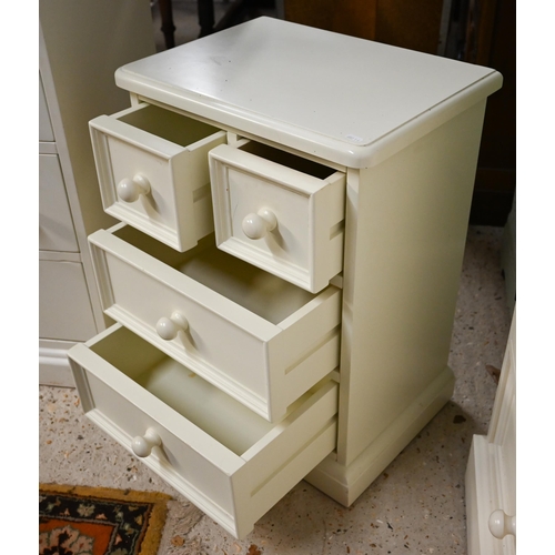 321 - An off-white painted child's bedroom chest, arrangement of thirteen drawers and galleried back with ... 