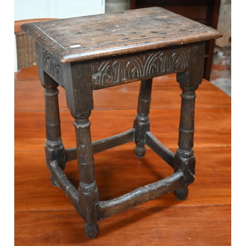 325 - An antique oak joint stool with lunette carved frieze, turned legs united by stretchers, 44 x 28 x 5... 