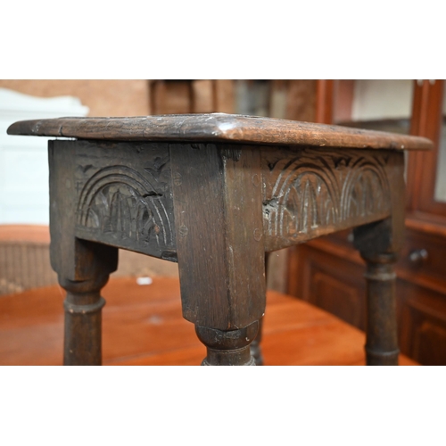 325 - An antique oak joint stool with lunette carved frieze, turned legs united by stretchers, 44 x 28 x 5... 