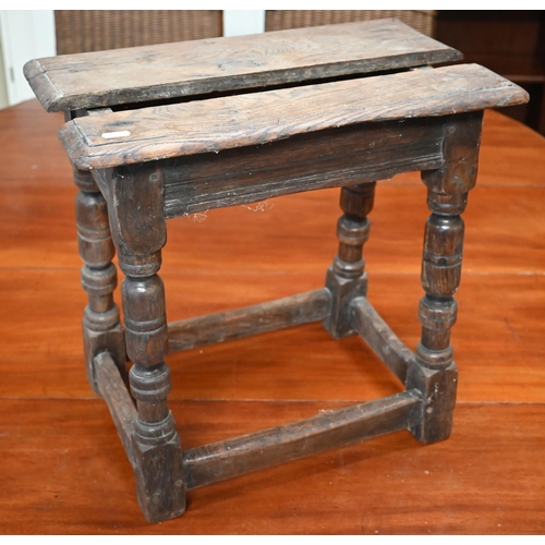 325 - An antique oak joint stool with lunette carved frieze, turned legs united by stretchers, 44 x 28 x 5... 