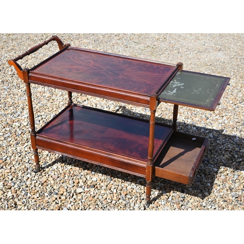 328 - A mahogany veneered two drawer filing chest and two tier drinks trolley with single drawer (2)