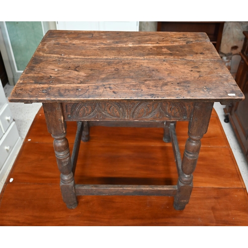 341 - A 17th century oak rectangular side table with lunette carved frieze, turned supports united by stre... 