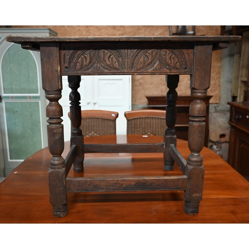 341 - A 17th century oak rectangular side table with lunette carved frieze, turned supports united by stre... 