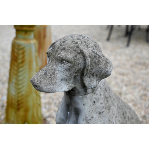 36 - A large composite stone seated dog statue, 73 cm h