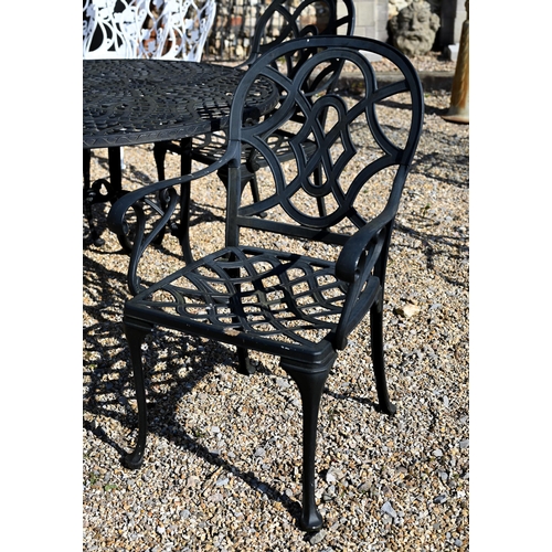 40 - A cast alloy circular garden table with four chairs 124 cm diam (5)